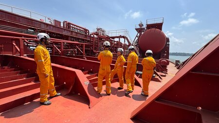 ITOPF team aboard the deck of Stolt Creativity chemical tanker wearing PPE